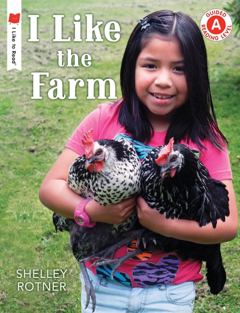 book cover: "I Like the Farm", by Shelley Rotner. Photo shows smailing young girl holding two chickens in her arms